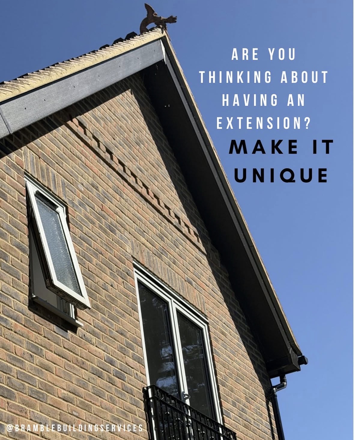 Brick building with extension under blue sky